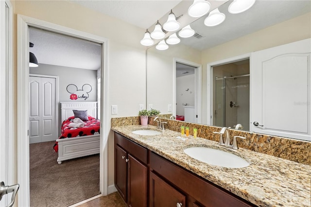 1432 Rolling Fairway Dr, Davenport, FL 33896 - full bathroom featuring double vanity, visible vents, a sink, and a stall shower