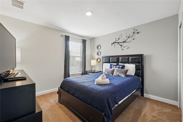1432 Rolling Fairway Dr, Davenport, FL 33896 - bedroom featuring light carpet, visible vents, baseboards, and a textured ceiling