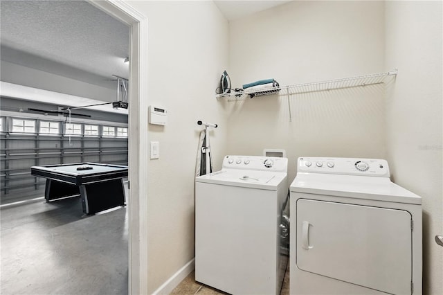 1432 Rolling Fairway Dr, Davenport, FL 33896 - washroom featuring washing machine and clothes dryer, laundry area, and baseboards
