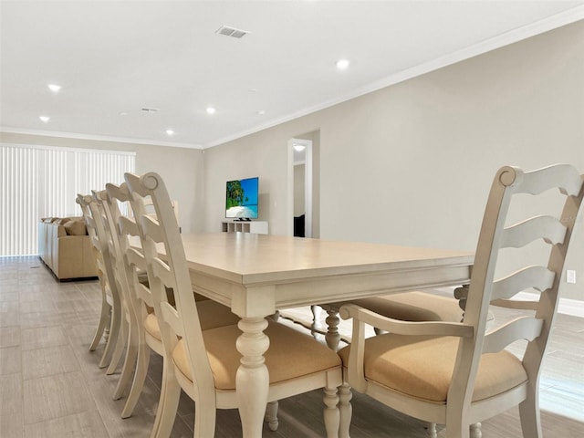 dining room featuring baseboards, recessed lighting, visible vents, and ornamental molding