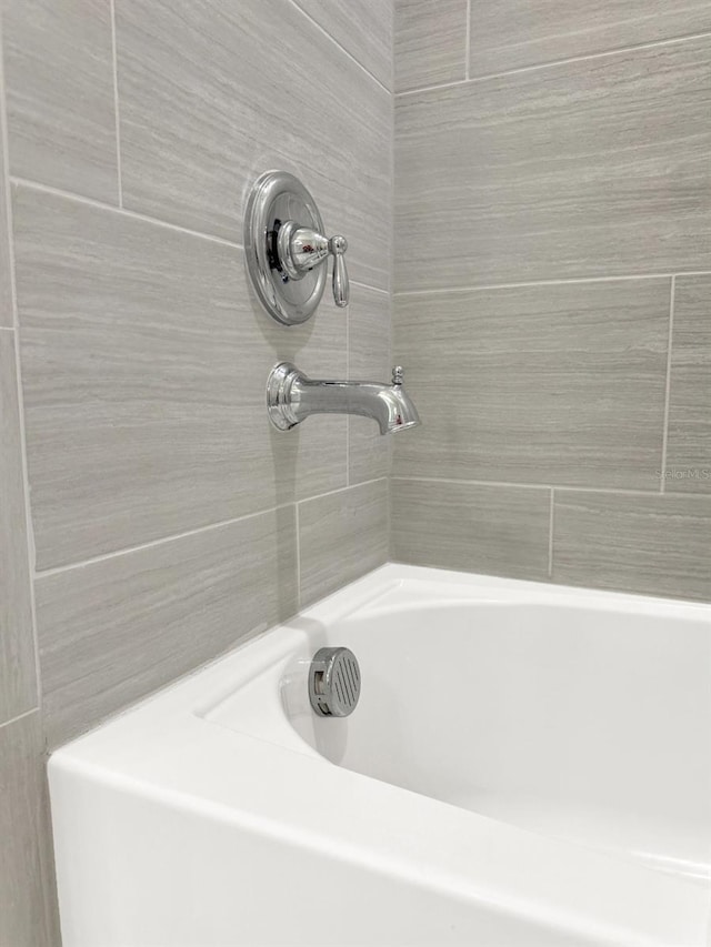 bathroom featuring a bathing tub and walk in shower