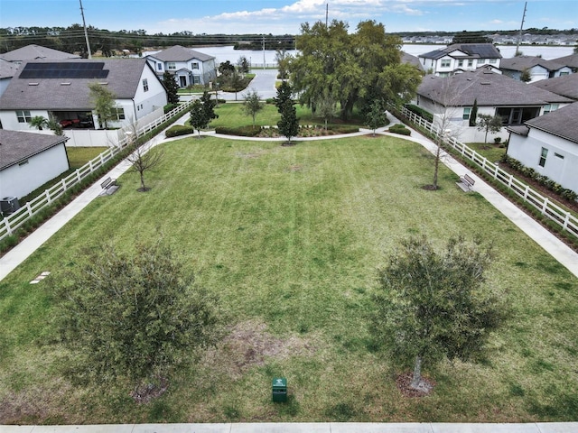 drone / aerial view with a residential view and a water view