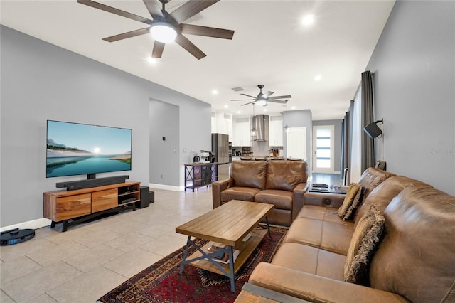 living room with a ceiling fan, visible vents, baseboards, light tile patterned flooring, and recessed lighting