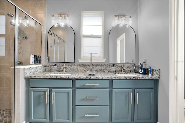 full bath with a sink and a stall shower