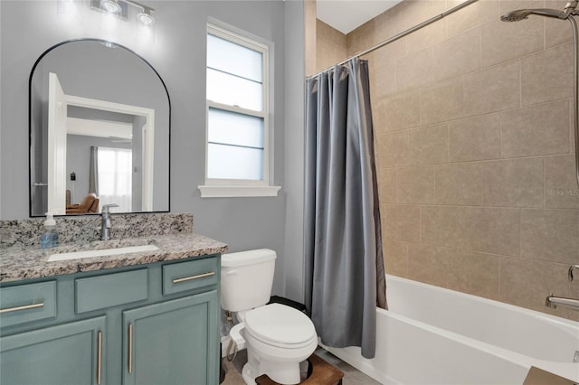 bathroom featuring vanity, toilet, and shower / bath combo