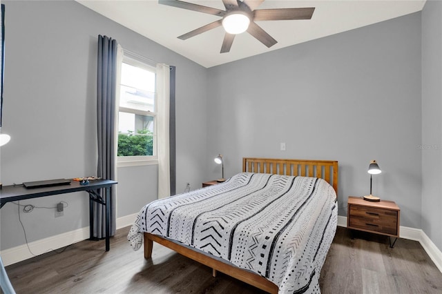 bedroom with baseboards, wood finished floors, and a ceiling fan