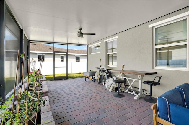 sunroom / solarium with ceiling fan