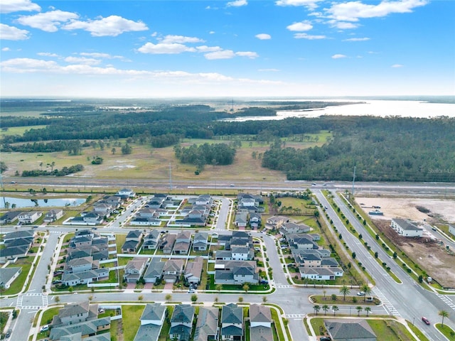 bird's eye view with a residential view and a water view