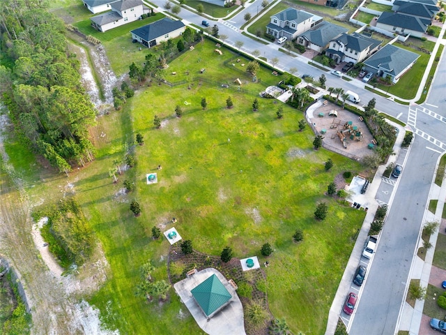 birds eye view of property with a residential view