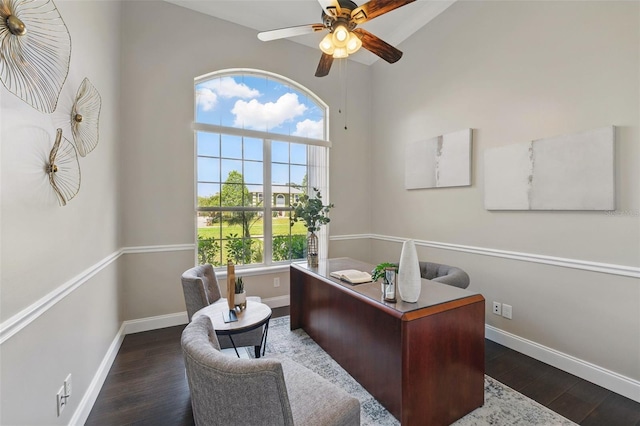 office space with baseboards, ceiling fan, and wood finished floors