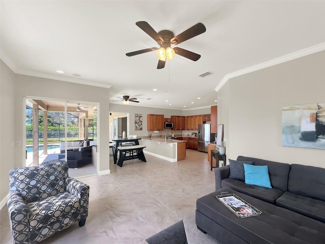 living room with ceiling fan, crown molding, recessed lighting, and baseboards