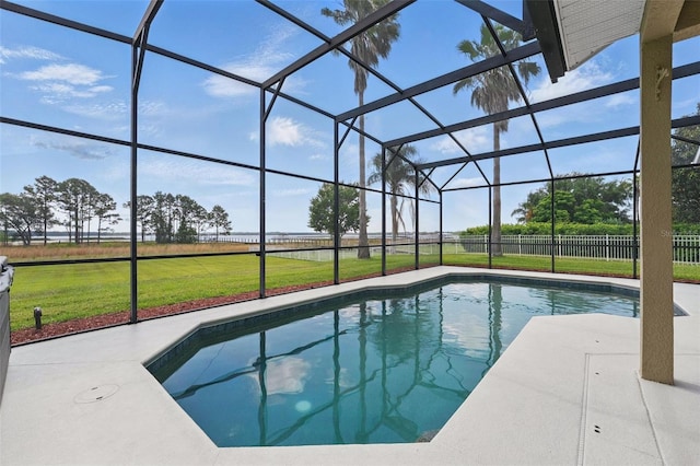 view of swimming pool featuring a lanai and a patio