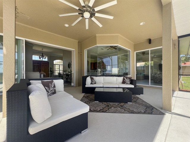 view of patio with an outdoor living space and ceiling fan