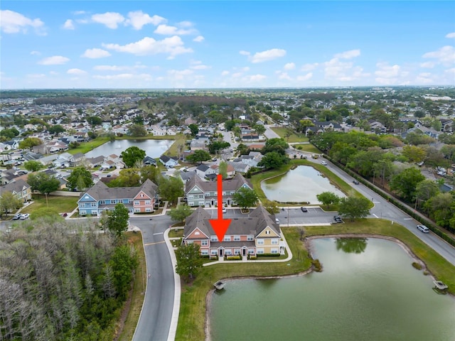 aerial view with a residential view and a water view