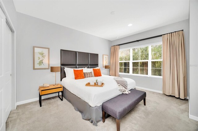 2619 Corvette Ln, Kissimmee, FL 34746 - bedroom with recessed lighting, a closet, baseboards, and light colored carpet