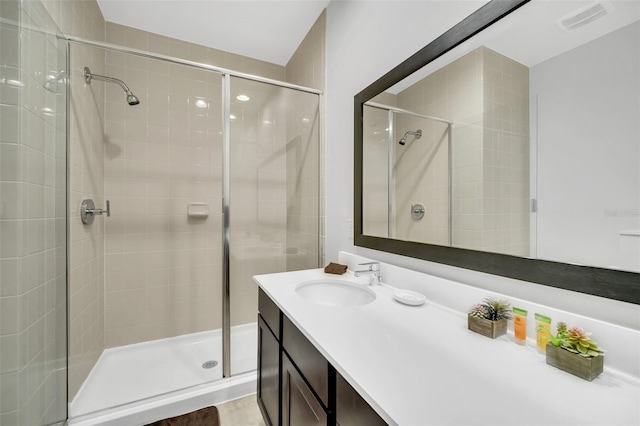 2619 Corvette Ln, Kissimmee, FL 34746 - full bathroom featuring visible vents, a stall shower, and vanity