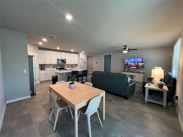dining area featuring recessed lighting, a ceiling fan, visible vents, and baseboards