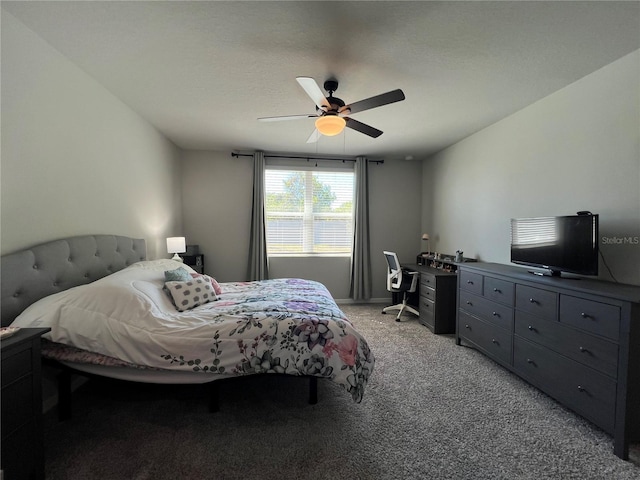 bedroom with ceiling fan and light carpet