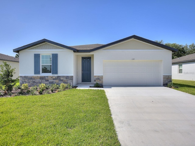 view of front of house featuring stone siding, a front lawn, concrete driveway, and an attached garage