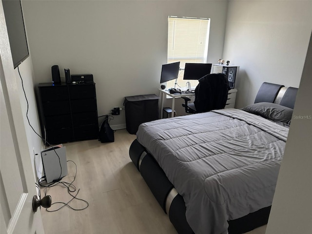 10197 Ridgebloom Ave, Orlando, FL 32829 - bedroom featuring light wood-style flooring and baseboards