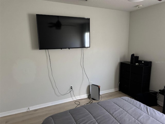 10197 Ridgebloom Ave, Orlando, FL 32829 - bedroom with baseboards and wood finished floors