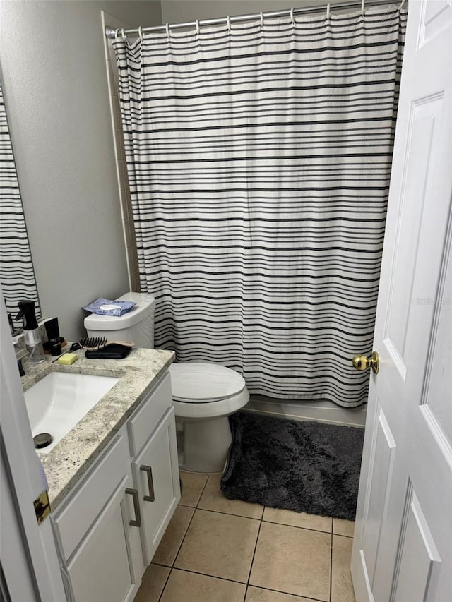 10197 Ridgebloom Ave, Orlando, FL 32829 - bathroom with tile patterned flooring, toilet, and vanity