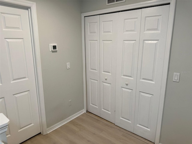 10197 Ridgebloom Ave, Orlando, FL 32829 - unfurnished bedroom featuring light wood-style flooring, visible vents, baseboards, and a closet