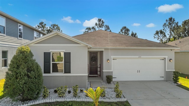 1153 Augustus Dr, Davenport, FL 33896 - single story home featuring concrete driveway, roof with shingles, stucco siding, and an attached garage