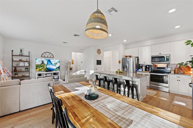 1153 Augustus Dr, Davenport, FL 33896 - dining space featuring visible vents, light wood-type flooring, and recessed lighting