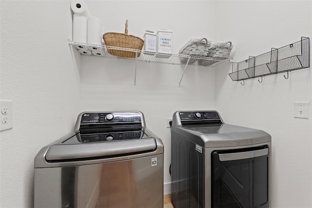 1153 Augustus Dr, Davenport, FL 33896 - clothes washing area with washer and clothes dryer and laundry area