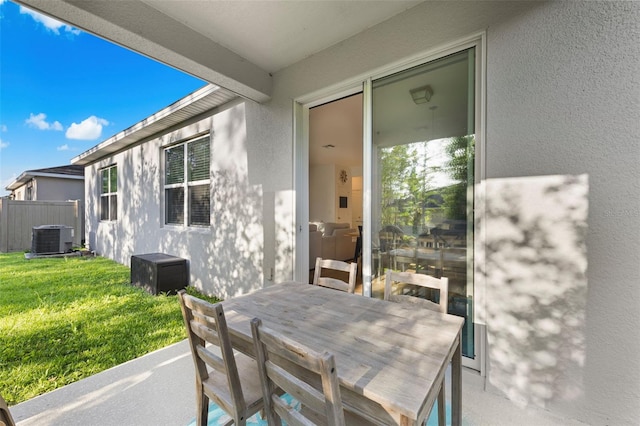 1153 Augustus Dr, Davenport, FL 33896 - view of patio / terrace with cooling unit, fence, and outdoor dining area