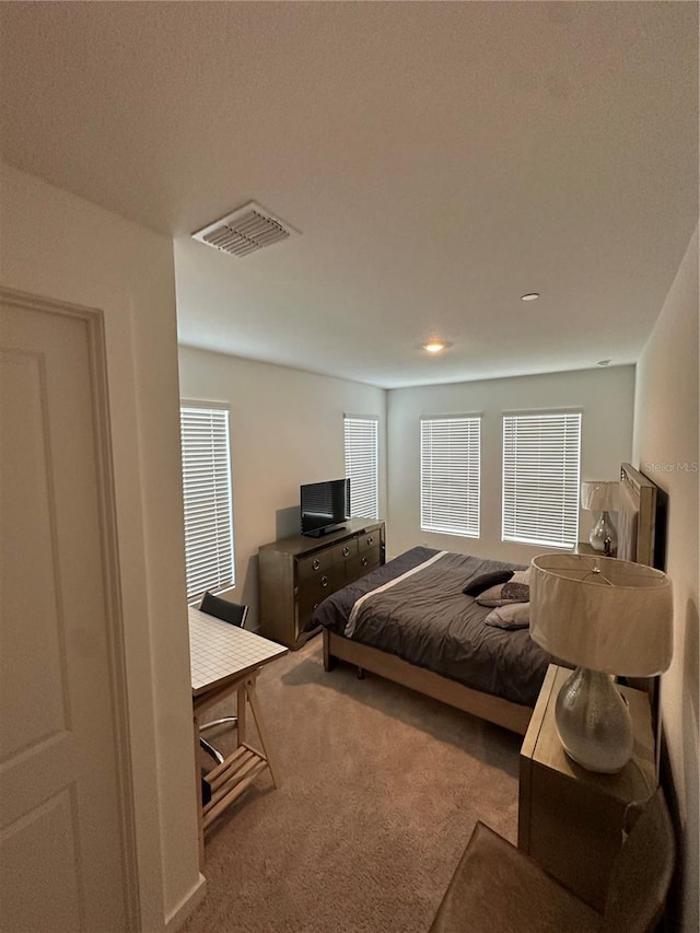 12673 Yoshino Aly, Orlando, FL 32827 - carpeted bedroom featuring visible vents