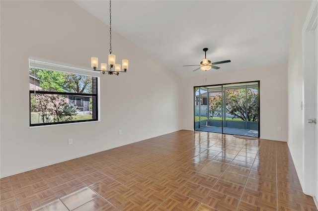 2435 King Oak Ln, Saint Cloud, FL 34769 - unfurnished room with ceiling fan with notable chandelier and high vaulted ceiling