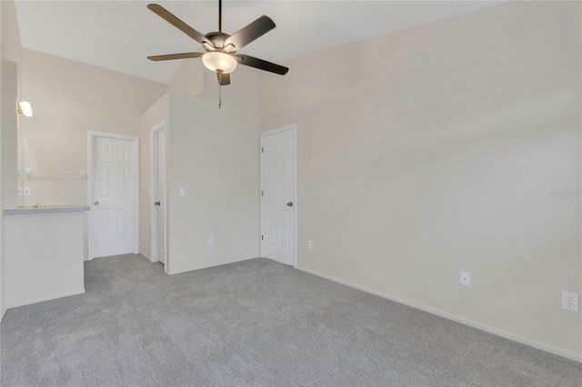 2435 King Oak Ln, Saint Cloud, FL 34769 - empty room with high vaulted ceiling, ceiling fan, and carpet floors