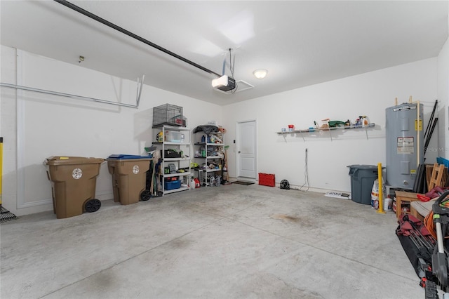 garage featuring electric water heater and a garage door opener