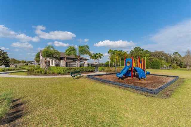 community playground featuring a lawn
