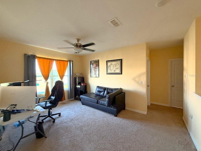 office area with a ceiling fan, carpet, baseboards, and visible vents