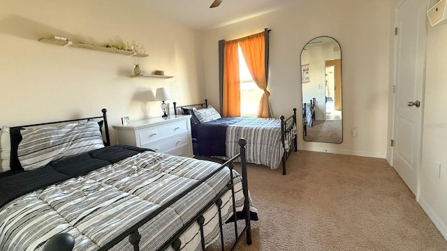 bedroom with baseboards, ceiling fan, and light colored carpet