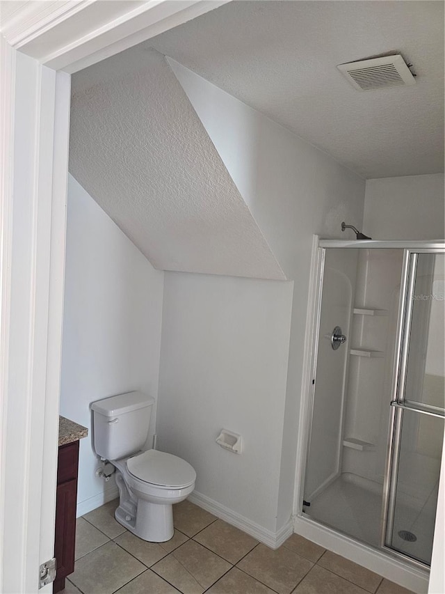 2921 Puerta Del Sol Blvd, Kissimmee, FL 34744 - full bathroom featuring tile patterned flooring, a shower stall, toilet, and visible vents