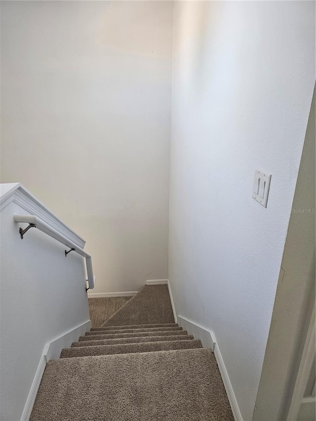 2921 Puerta Del Sol Blvd, Kissimmee, FL 34744 - stairs featuring baseboards and carpet floors