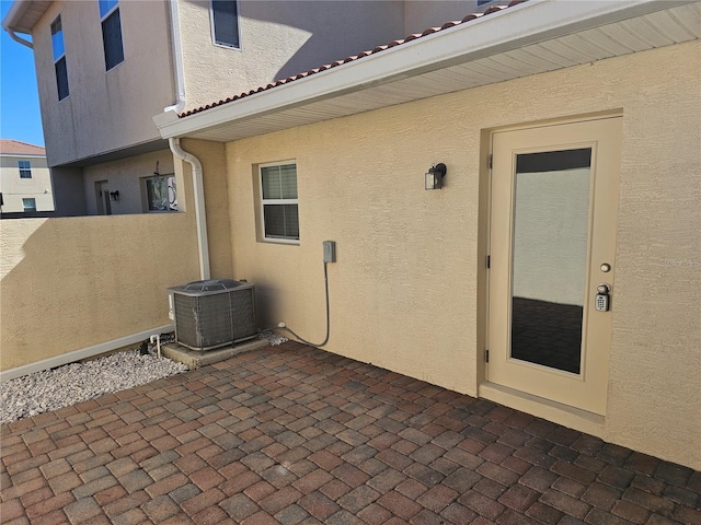 2921 Puerta Del Sol Blvd, Kissimmee, FL 34744 - view of patio featuring central AC