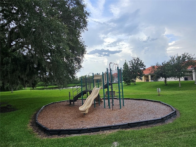 2921 Puerta Del Sol Blvd, Kissimmee, FL 34744 - community jungle gym featuring a lawn