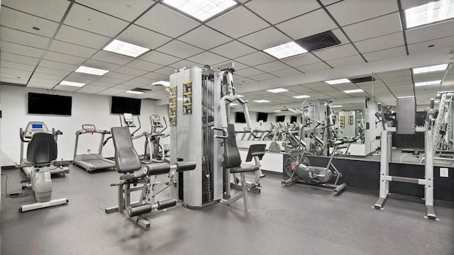 gym featuring a paneled ceiling and visible vents