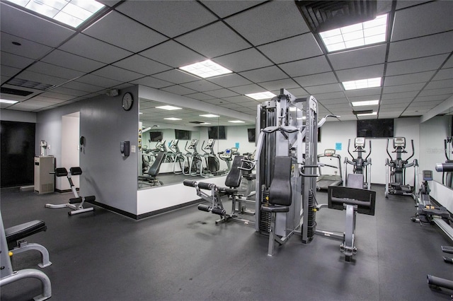 exercise room with a drop ceiling