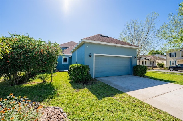 view of side of property featuring stucco siding, driveway, a shingled roof, and a yard