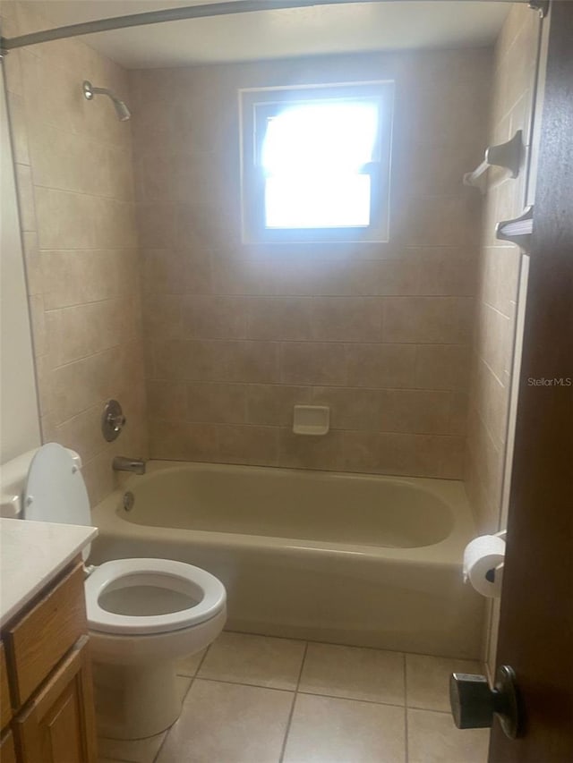 bathroom featuring shower / bathtub combination, toilet, tile patterned flooring, and vanity