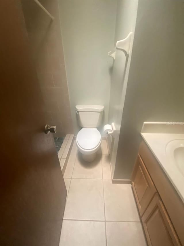 full bath with vanity, tile patterned flooring, walk in shower, and toilet