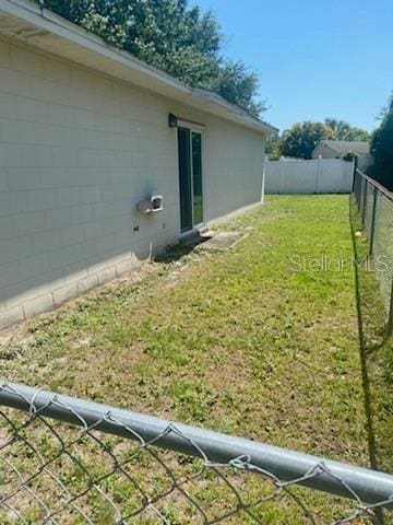 view of yard with a fenced backyard