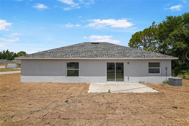 101 Sail Way, Kissimmee, FL 34759 - rear view of property featuring stucco siding, a shingled roof, a patio area, and cooling unit