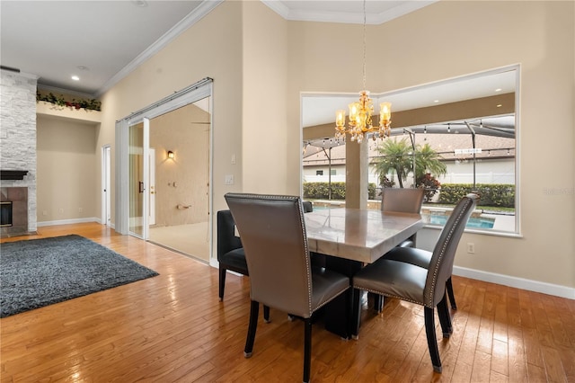 3637 Rothbury Dr, Belle Isle, FL 32812 - dining space featuring wood-type flooring, ornamental molding, plenty of natural light, and a chandelier